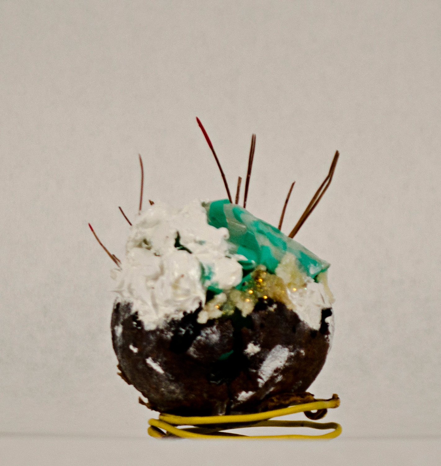 Jessica Lund, cupcake, 2014. Walnut, paint, plastic, pine needles, glitter, found wire, 4 x 3 x 3 in.