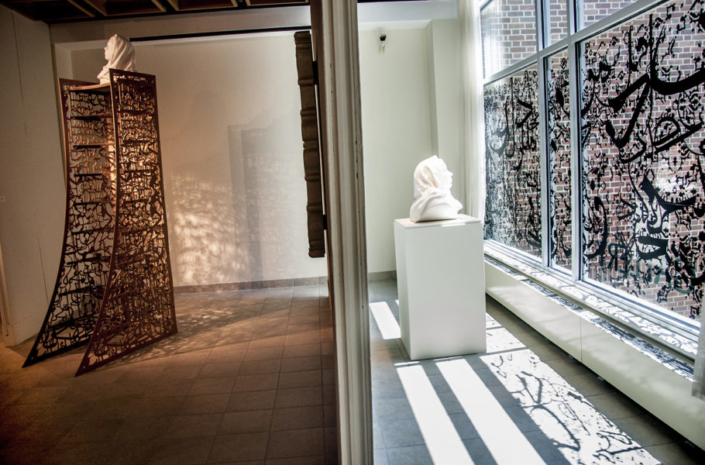 Kiana Honarmand, Right: Stone; Left: Rise and Obey, 2016, Right: Vinyl Window Installation and Ceramic Bust; Left: CNC Machined MDF and Masonite, CNC Machined Foam, Plaster, 20" x 30"