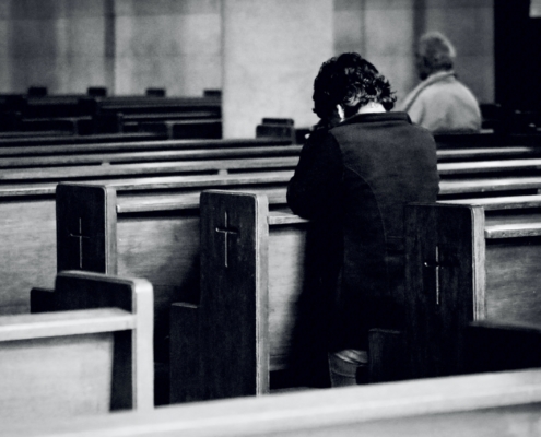 A person praying in church