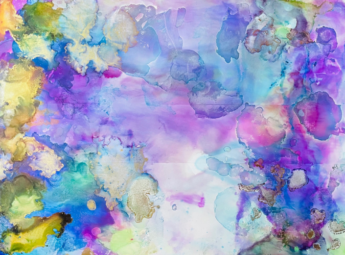 Purples light blues and golds in alcohol ink