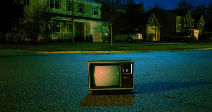 Television in the middle of a suburban street