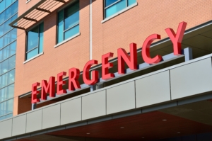 EMERGENCY written in red letters on a medical multi-storied buliding