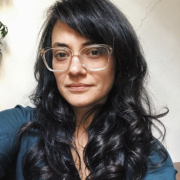 image of a person with long hair and wearing glasses