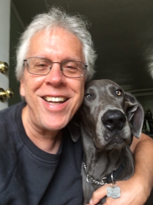 Bob Kirwin headshot, person smiling with dog