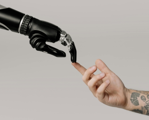 Cottonbro Studio robot and human hand touching fingers