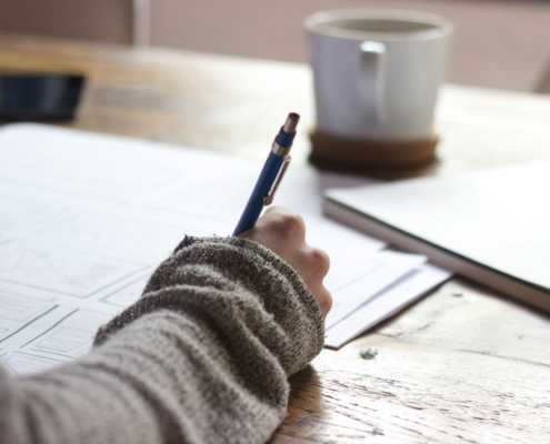 Writer with sweater and coffee