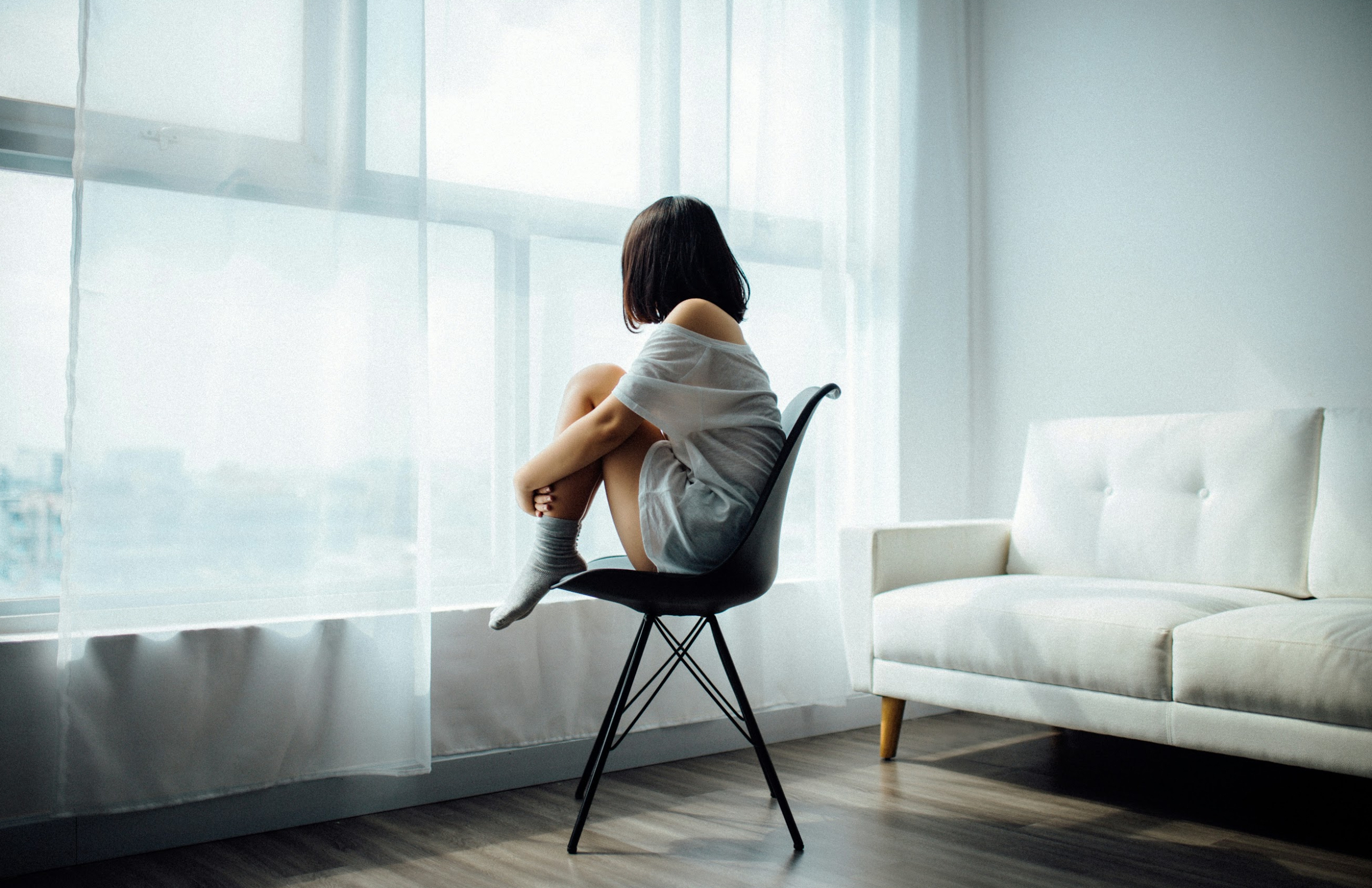 Person sitting alone in room 