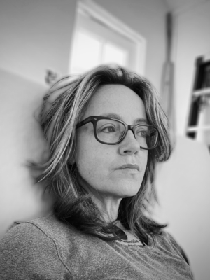 Black and white photo of person with glasses Elisa Carlsen photo