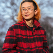 Person in red and black flannel jacket Jack Cheng headshot