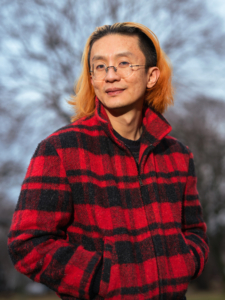 Person in red and black flannel jacket Jack Cheng headshot