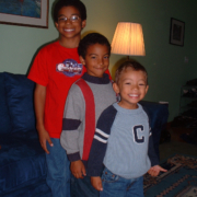 Children standing together in home