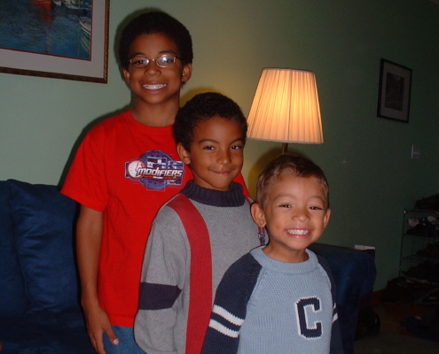 Children standing together in home