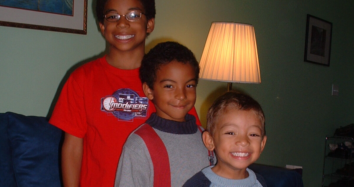 Children standing together in home