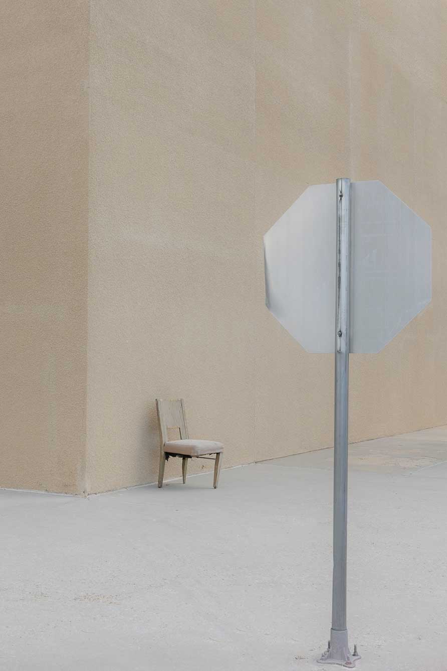sign and chair, archival natural pigment print on Italian cotton rag, dimensions variable, 2019