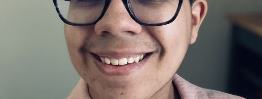 author smiling at the camera