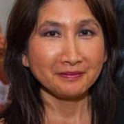 Author smiling at the camera