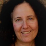 Headshot of author smiling into the camera