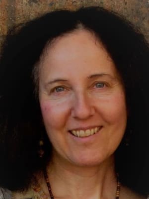 Headshot of author smiling into the camera