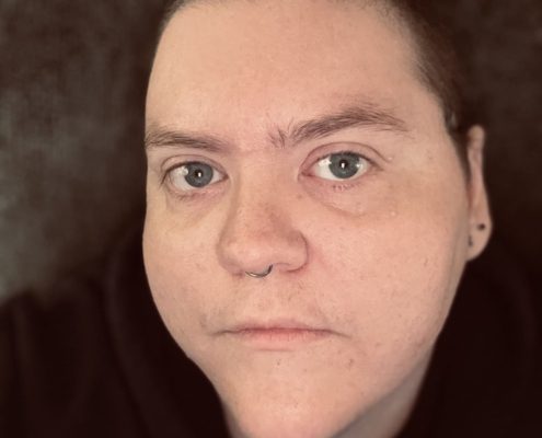 author looking directly into the camera