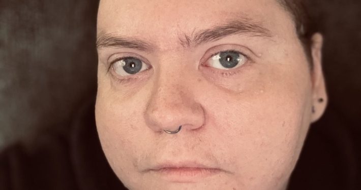 author looking directly into the camera