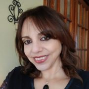 author smiling at camera