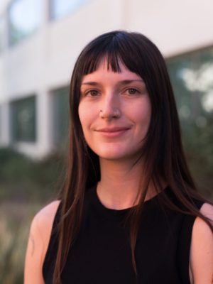 author smiling at the camera