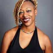 author smiling at the camera