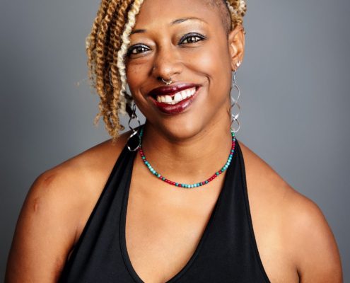 author smiling at the camera